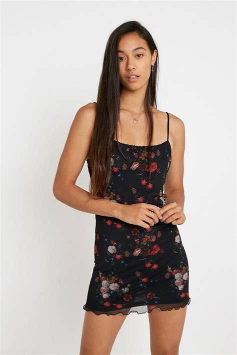 Crafted out of sleek satin and cut in a short slim-fitting silhouette with a crew neckline. . Urban outfitters mini dress